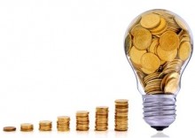 Golden lightbulb, creative symbol of renewable energy sources ÉCONOMIQUE